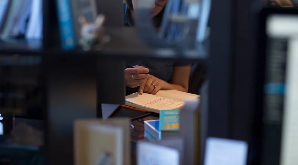 A photo of someone consulting their notebook