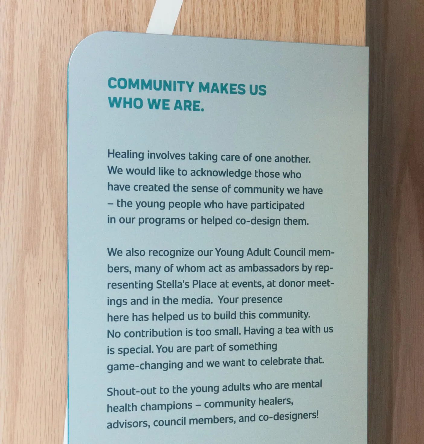 A close-up of a sign describing the community at Stella's Place.