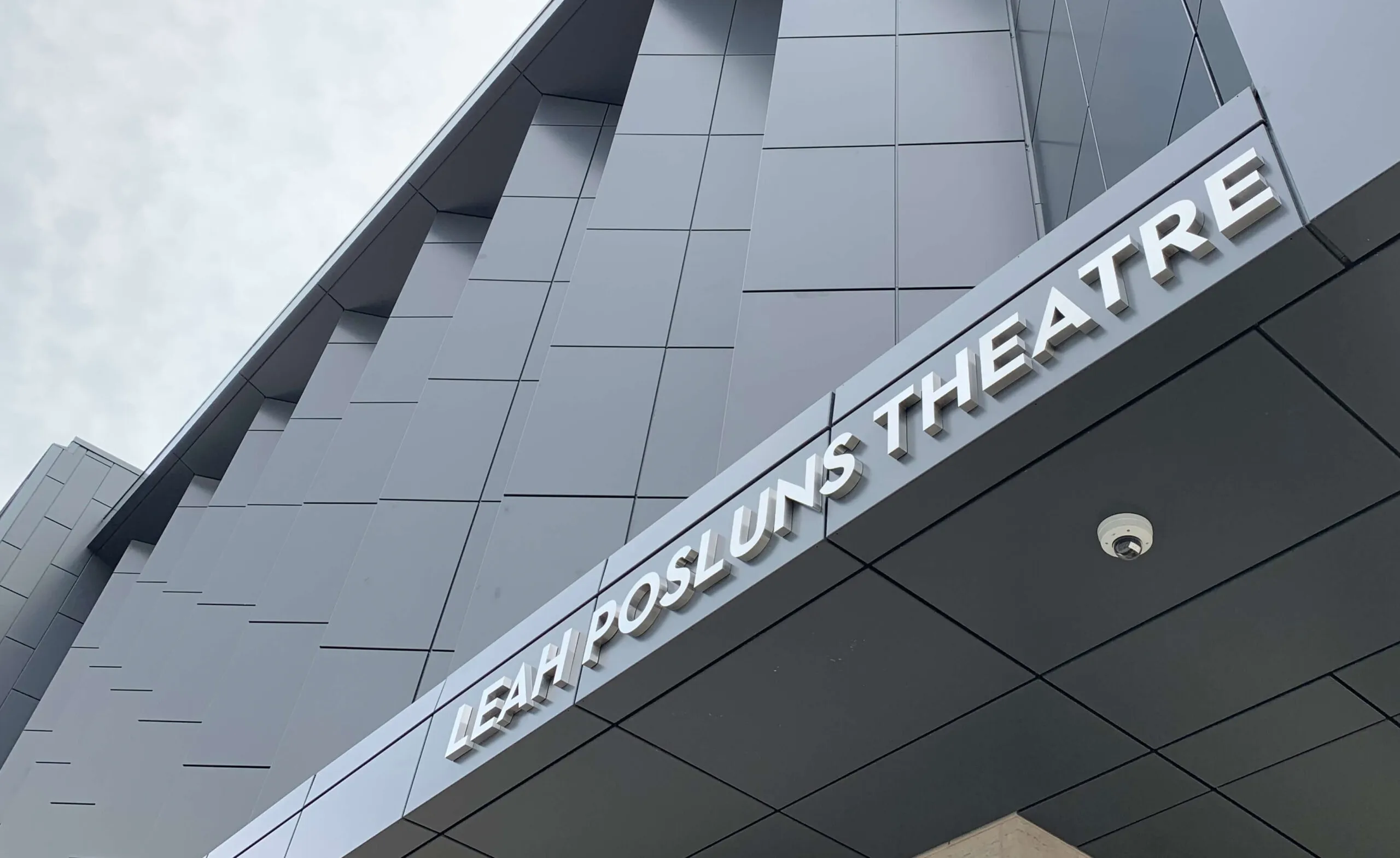 Close-up of building signage lettering.